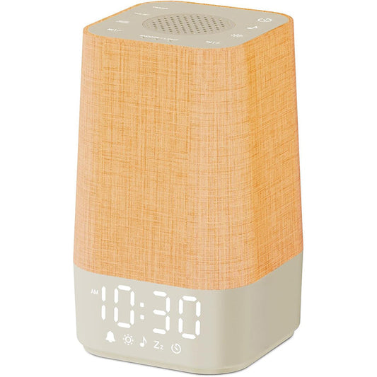 Sunrise white noise machine beside a bed, creating a soft start to the morning